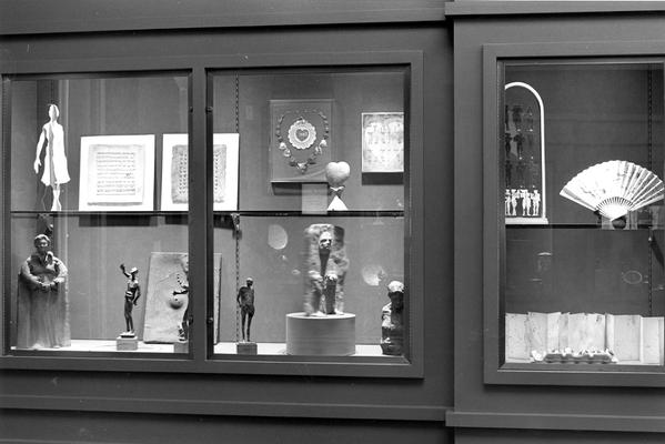 An image of various artwork in exhibit cases at the 