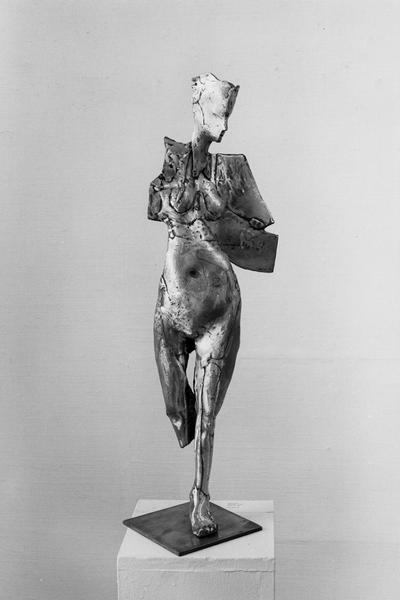 A bronze figure sculpture of a female nude in the 