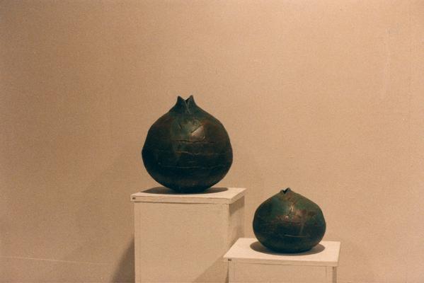 An image of two spherical shaped ceramic vessels in the 