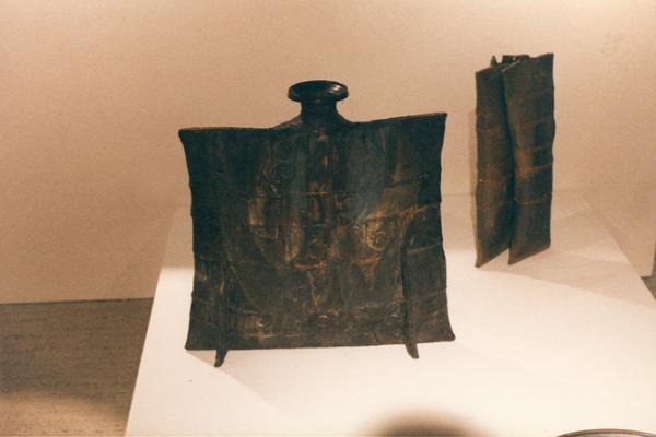 An image of two ceramic pouch vessels in the 