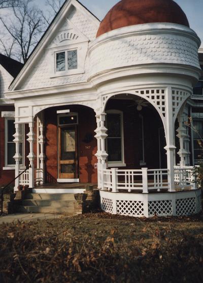 The front of the Tuska Gallery house, which was the home of John Tuska. The house is a one and a half story Queen Ann, with a circular porch