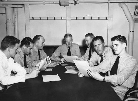 John Tuska and Navy officers in a meeting aboard the U.S.S. Wasp
