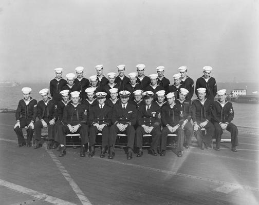 An image of John Tuska, Navy shipmates and Captain B. C. McCaffree aboard the U.S.S. Wasp