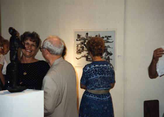 A image of unidentified persons viewing artwork at the Heike Pickett Gallery