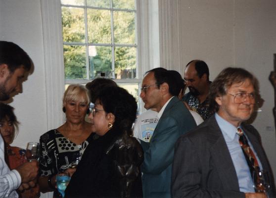A image of Jack Gron and unidentified persons viewing artwork at the Heike Pickett Gallery