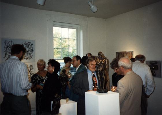 A image of unidentified persons viewing artwork at the Heike Pickett Gallery