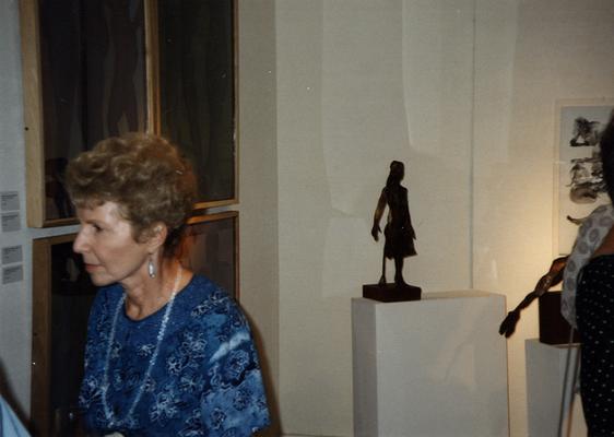 A image of unidentified woman viewing artwork at the Heike Pickett Gallery