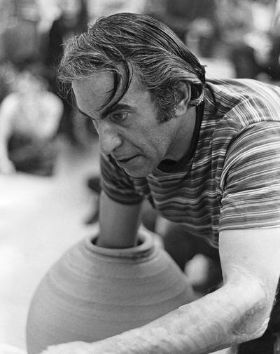 Artist Peter Voulkos works on a ceramic vessel for a class at the University of Kentucky. John Tuska was in attendance