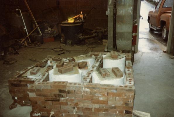 Molds and the furnace in the University of Kentucky foundry. The photograph was taken by Zig Gierlach