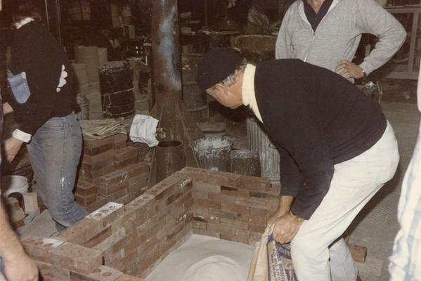 John Tuska and three students preparing for a pour in the University of Kentucky foundry. The photograph was taken by Zig Gierlach