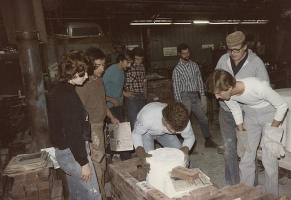 John Tuska and seven students moving molds in the University of Kentucky foundry. The photograph was taken by Zig Gierlach