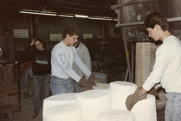 John Tuska and three students moving molds in the University of Kentucky foundry. The photograph was taken by Zig Gierlach
