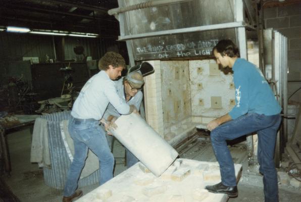 John Tuska and two students moving molds in the University of Kentucky foundry. The photograph was taken by Zig Gierlach