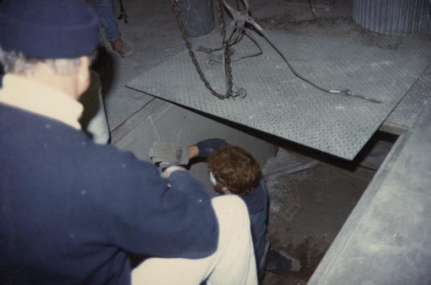 Two students working in the University of Kentucky foundry class. The photograph was taken by Zig Gierlach