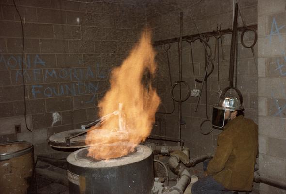 Jack Gron near the open furnace in the University of Kentucky foundry. The photograph was taken by Zig Gierlach