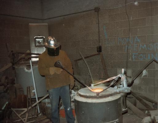 Jack Gron working with the furnace in the University of Kentucky foundry. The photograph was taken by Zig Gierlach