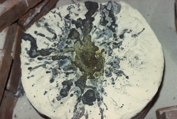 A mold after the pouring of molten metal in the University of Kentucky foundry. The photograph was taken by Zig Gierlach