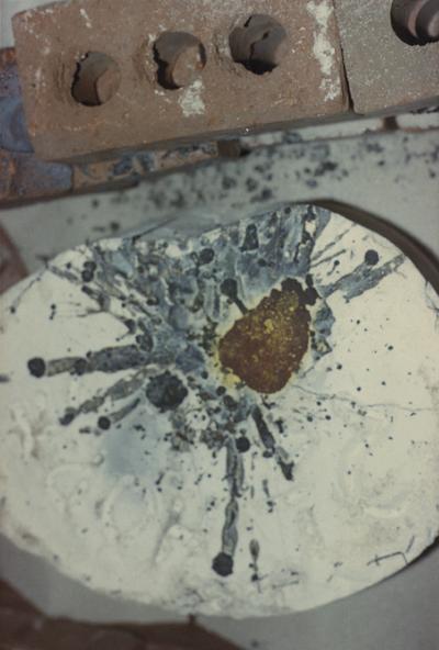 A mold after the pouring of molten metal in the University of Kentucky foundry. The photograph was taken by Zig Gierlach