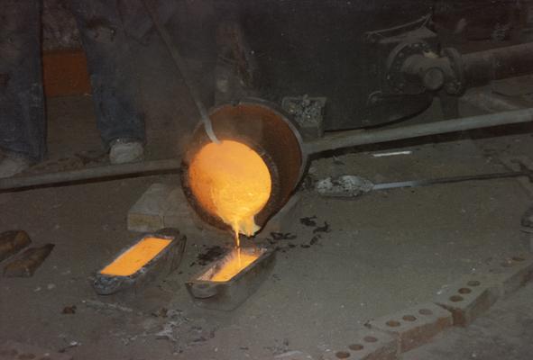 The end of a pour of molten metal in the University of Kentucky foundry. The photograph was taken by Zig Gierlach