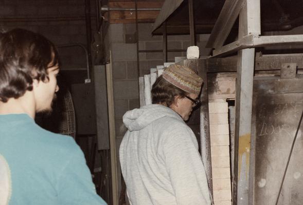 An unidentified student and John Tuska in the University of Kentucky foundry. The photograph was taken by Zig Gierlach