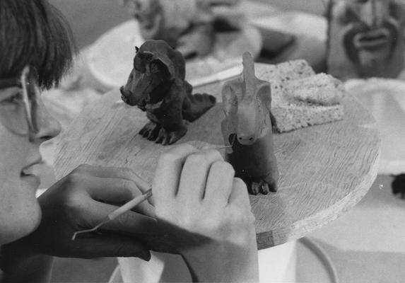 A student working on clay sculptures in John Tuska's ceramics class at the University of Kentucky