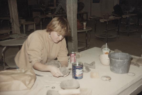 A student working on clay in John Tuska's ceramics class at the University of Kentucky