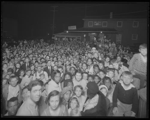 Cogar Rumley Company (hardware, furniture, home furnishings); exterior crowd (Firestone Tires)