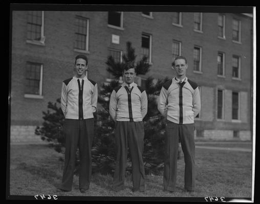 Transylvania College; basketball team; three men standing in front of tree and building