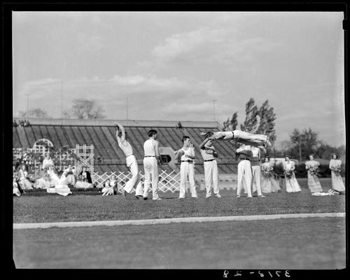 University of Kentucky May Day; acrobats performing on football field