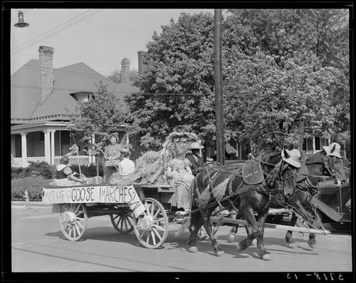 University of Kentucky May Day; float in parade, horse pulling float