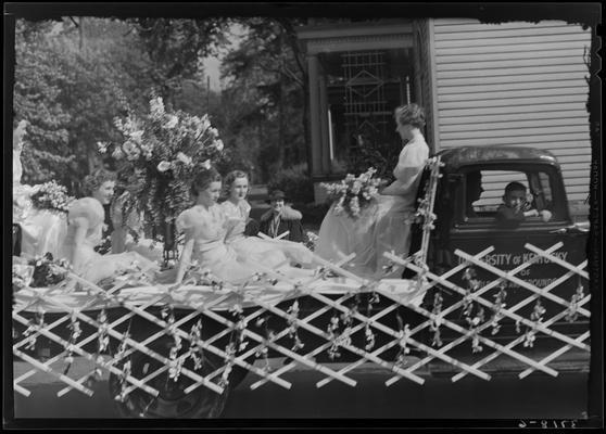 University of Kentucky May Day; float in parade; women sitting on truck bed