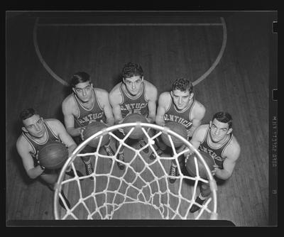 Group of players under basketball goal