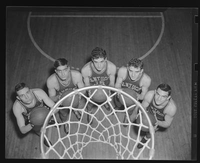 Group of players under basketball goal