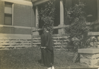 a woman in graduation cap and gown (appears to be the same woman as in item #25, #26, and #33)