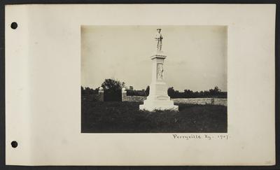 Large marble memorial statue with man wearing hat and uniform with a mustache and gun, reads                          Nor braver bled for a brighter land, nor brighter land had cause so grand. Confederate Memorial, notation                          Perryville, KY 1907