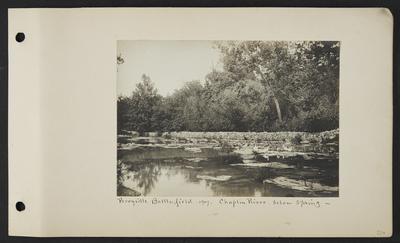 River with stone fence running along far back, multiple ducks standing on rocks in the middle of the river, notation                          Perryville Battlefield 1907 Chaplin River, below spring