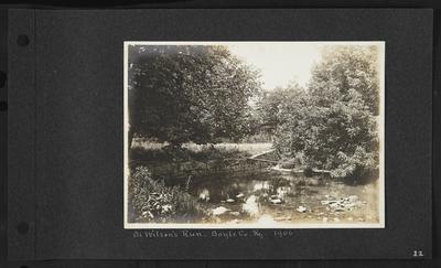 River with stone border on left side, plank leading from bank to little island, notation                          On Wilson's Run - Boyle Co. Ky. 1906