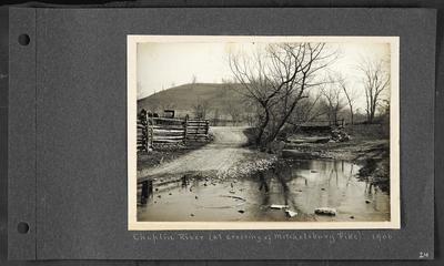 River crossing a low roadyway, wooden fencing on left with horse and small carriage in background, wooden bridge crossing river on right, notation                          Chaplin River (at crossing of Mitchelsburg Pike) 1906