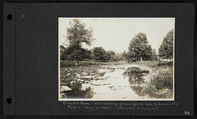 Shallow river with small rocks, woman and horse drawing phaeton in background, notation                          Clark's Run - at crossing of road from Lex. To Lancaster Pikes - July 4, 1906. Mrs. T.P.C. in Phaeton