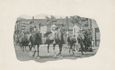 Three mounted men in a Memorial Day Parade, handwritten in ink on back: 