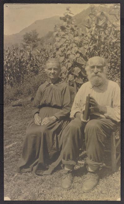 North Carolina students. Label on the back of the photograph reads: 'Uncle Ob', of the North Carolina Hills, learned to read and write after his eightieth birthday. He and his favorite schoolmate- his good wife- spend many happy hours reading their 'big print testament'. Through their influence more than fifty of their descendents have attended night school