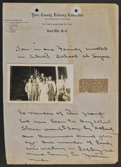 South Carolina students. The header of the page reads: York County Literacy Committee. Rock Hill, S.C. Above the photograph is written: Ten in one family enrolled in a pupil school at Smyrna. Below the photograph is written: No member of this group had even been to day school. Three went to day school one summer several years ago. One member of family was visiting in Gaffery and missed having his picture made