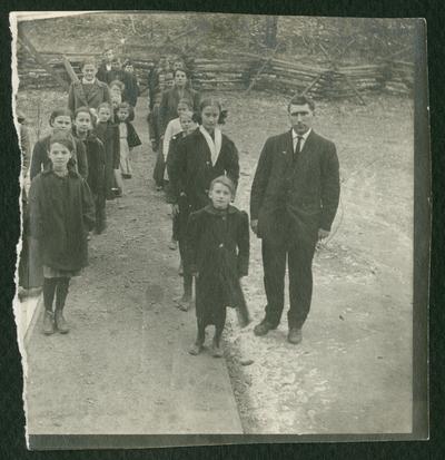 Two lines of children standing outside, similar image as item 352