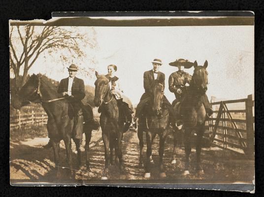 Moonlight School teachers, 2 men and 2 women. The back of the photograph reads: out searching for pupils