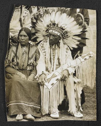 Unidentified man and woman, wearing tradition Natica American dress