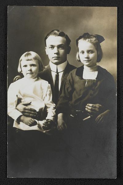 Grayson County teacher with two young women. Back of the photograph reads: Mrs. Stewart. Compliments from Grayson County teacher