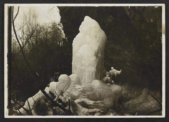 Tower of ice at the bottom of a canyon with forest, back of the photograph reads: Cuyahoga Gorge Ice Tower