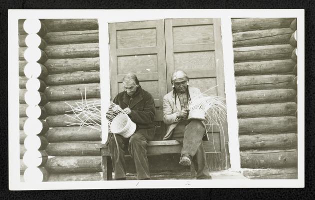 Two males, weaving baskets. Back of the photograph identifies them as: 1. Joseph Eagle Head 2. Wolf Plume