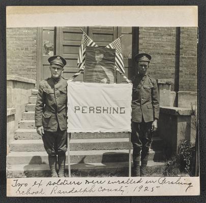 North Carolina students. Back of the photograph reads: Two ex-soldiers were enrolled in Pershing School. Randolph County, 1925. They couldn't write back to their people while in France because they had not had an opportunity to learn to read and write, but if they are ever away from home again they can write back; because they have learned to read and write in their little school 'Pershing'