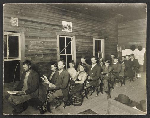 Kentucky studnets. Back of the photograph reads: Picture No. 2- Wording: Moonlight School, Christy, Rowan County, Miss Anna Carter, teacher, 32 enrolled